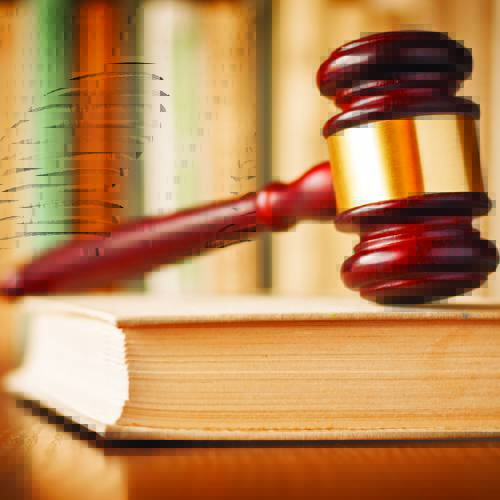 Image of gavel sitting on law book